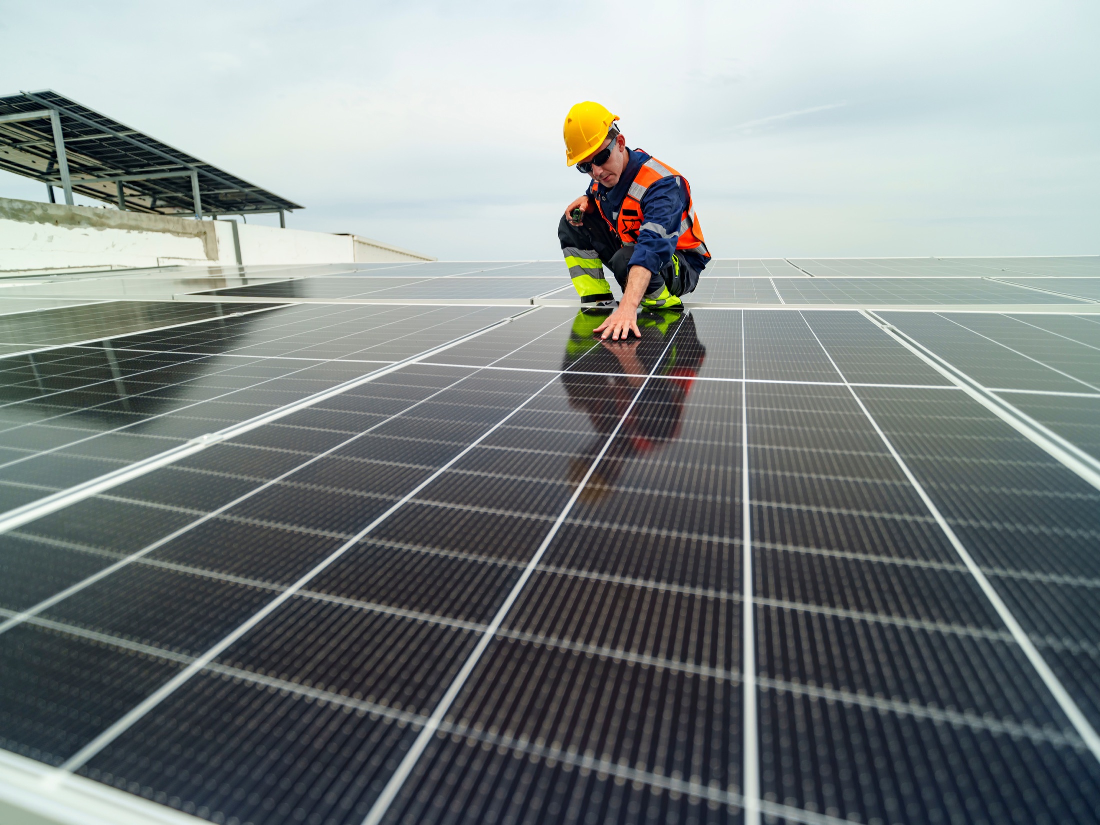 Technician working on photovoltaic modules